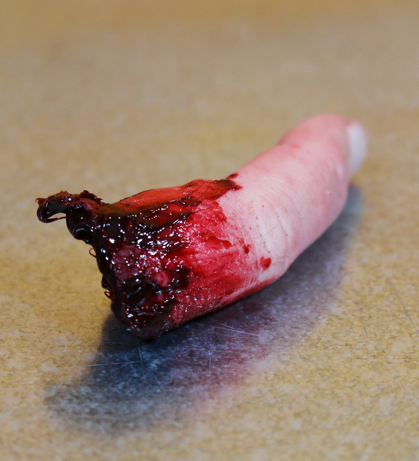 Bloody severed finger. Halloween decoration, creepy gift, pranks or horror prop