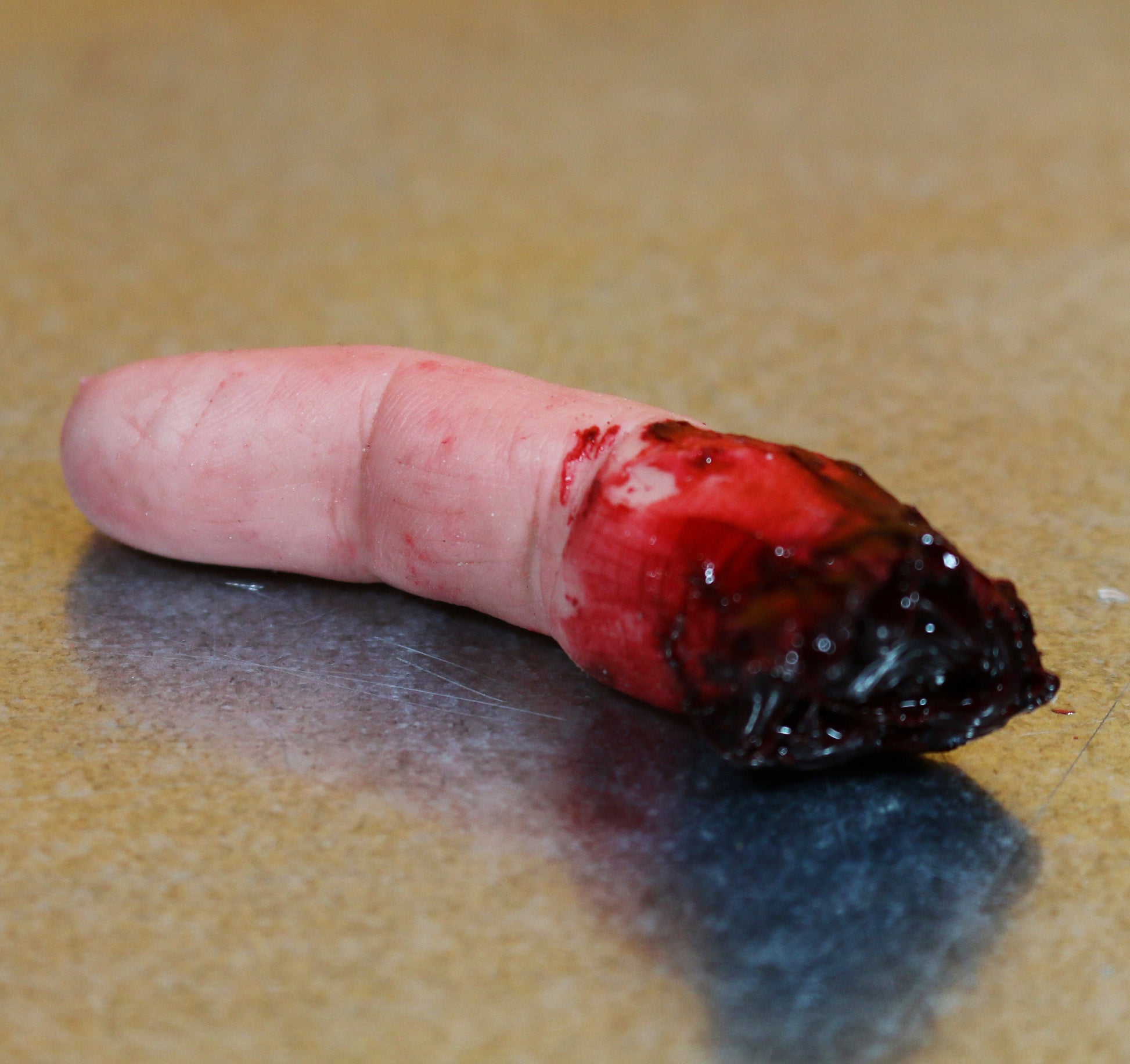 Bloody severed finger. Halloween decoration, creepy gift, pranks or horror prop